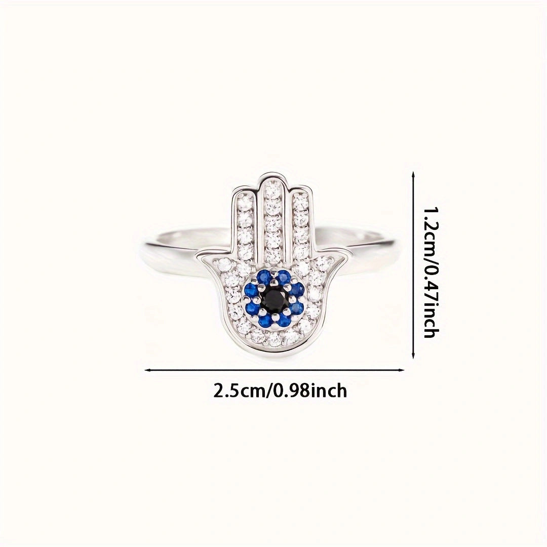 Hamséa Ring – Anel em Prata 925 com símbolo Hamsá cravejado e zircônias em azul e branco