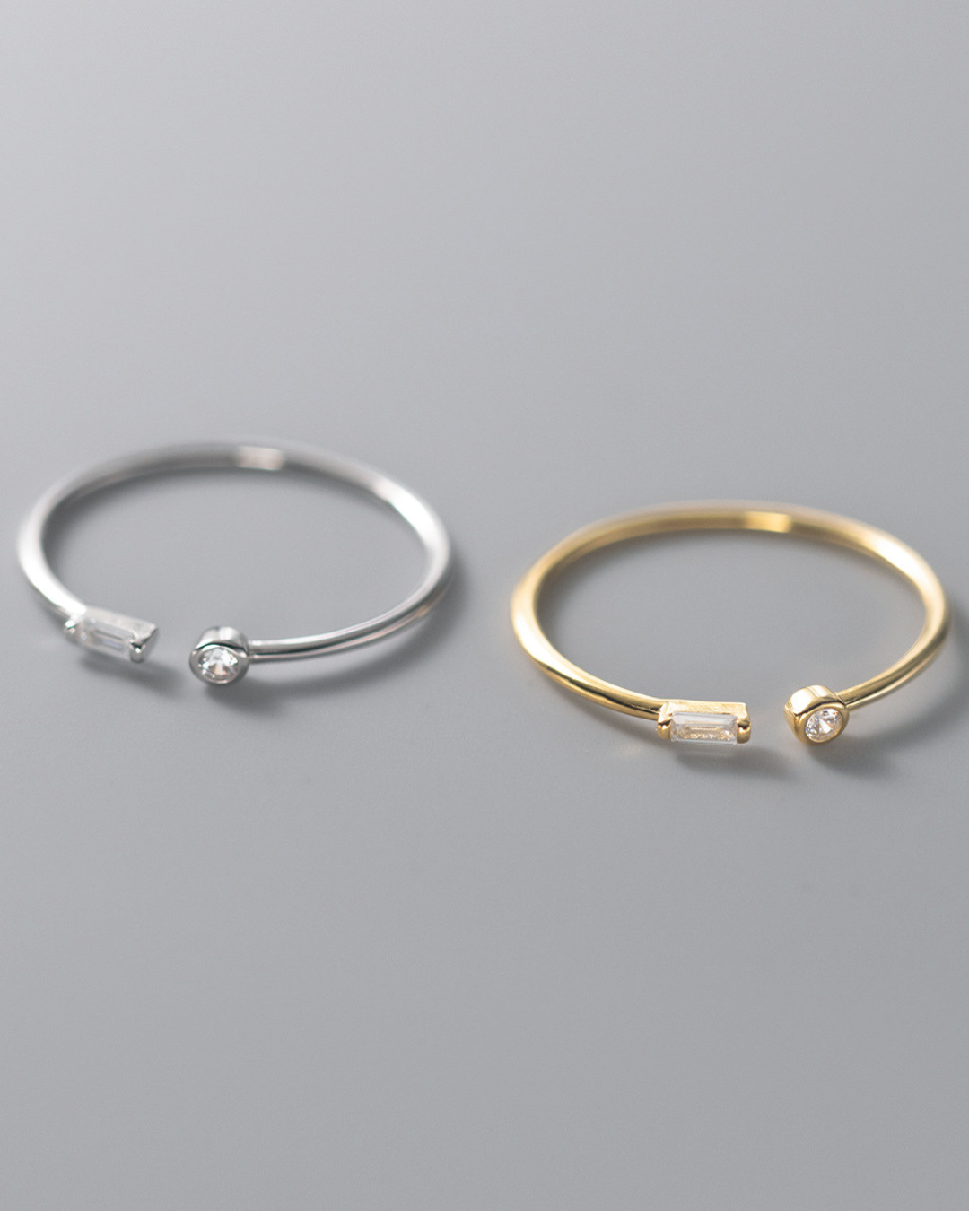 Iselya Ring – Anel aberto com zircônias lapidadas, disponível em prata e dourado com design minimalista