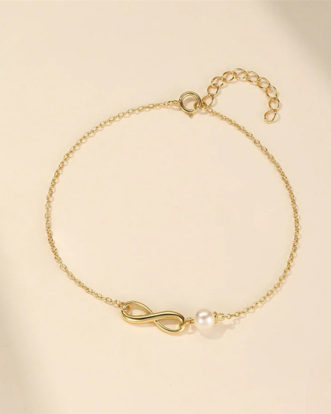 Verona Pearl Pulseira Feminina Dourada com Pérola e Símbolo Infinito