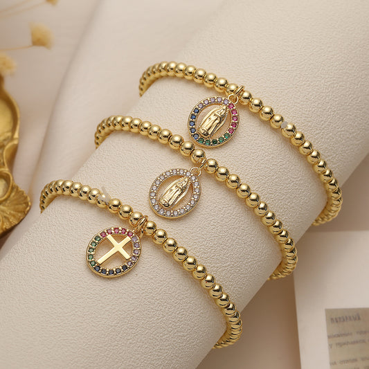 Santo Spirito – Pulsera Religiosa Dorada con Cruz y Colgante de la Virgen María | Circonita | Serenyah