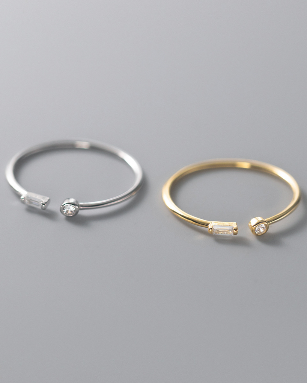 Iselya Ring – Anel aberto com zircônias lapidadas, disponível em prata e dourado com design minimalista